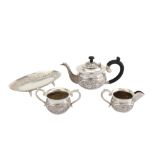 A mid-20th century Indian Raj unmarked silver four-piece tea service, South Indian circa 1950