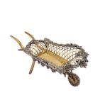 A George V sterling silver parcel-gilt novelty bon bon wheelbarrow, London 1916 by Goldsmiths & Silv