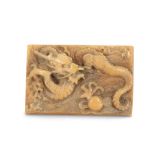 AN IVORY RECTANGULAR 'DRAGON' PLAQUE.