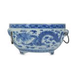 A CHINESE BLUE AND WHITE 'DRAGON' WARMER AND LINER.