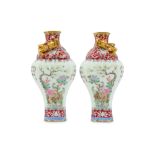 A PAIR OF CHINESE FAMILLE ROSE BALUSTER VASES.