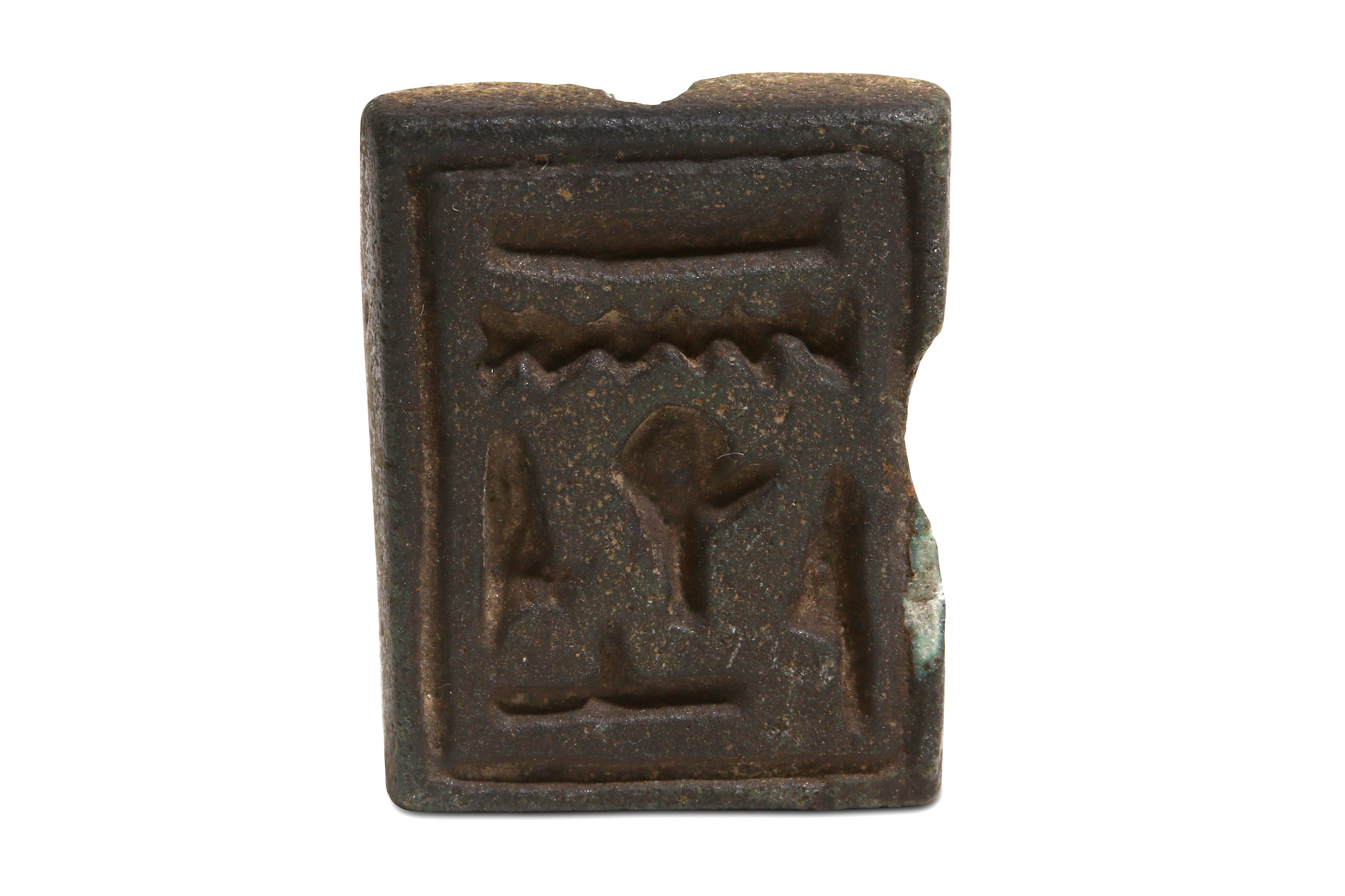 AN EGYPTIAN GREEN GLAZED COMPOSITION AMULET