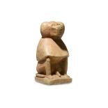 AN EGYPTIAN LIMESTONE SEATED BABOON