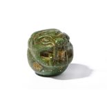 A PRE-COLUMBIAN GREEN STONE JAGUAR VESSEL