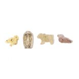 FOUR NEAR EASTERN HARDSTONE AND SHELL AMULETS