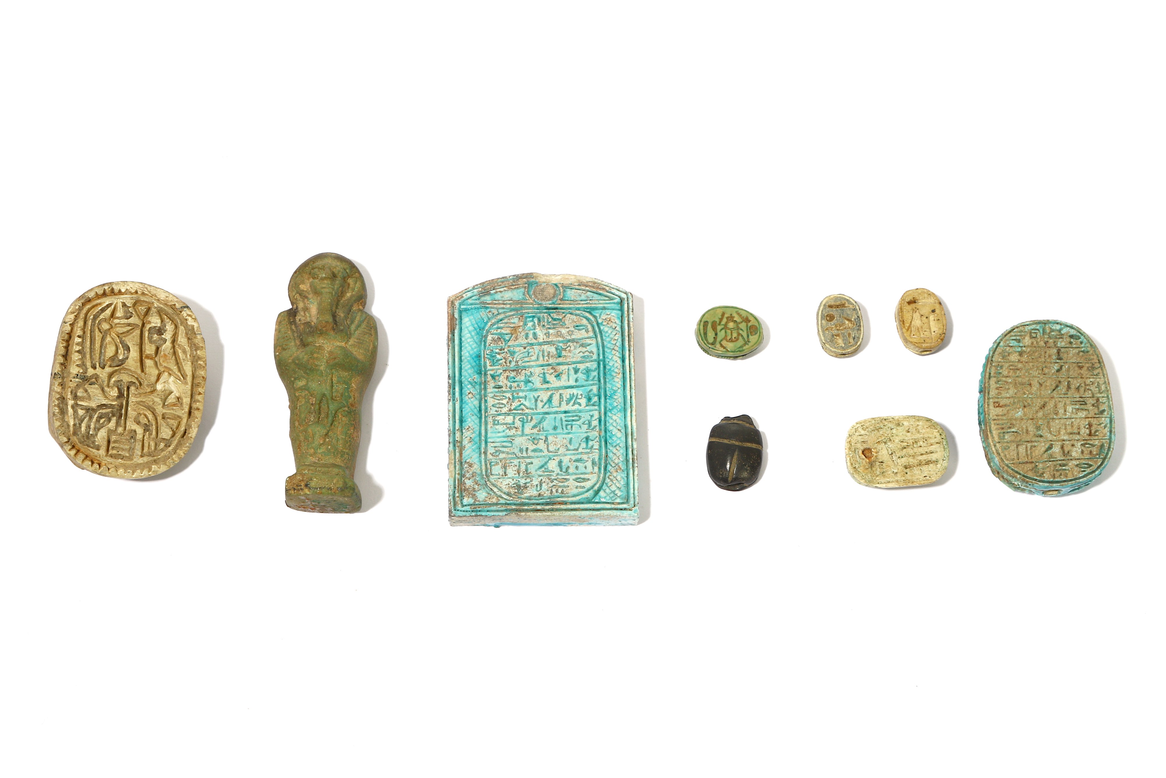 A GROUP OF EGYPTIAN SCARABS AND AMULETS