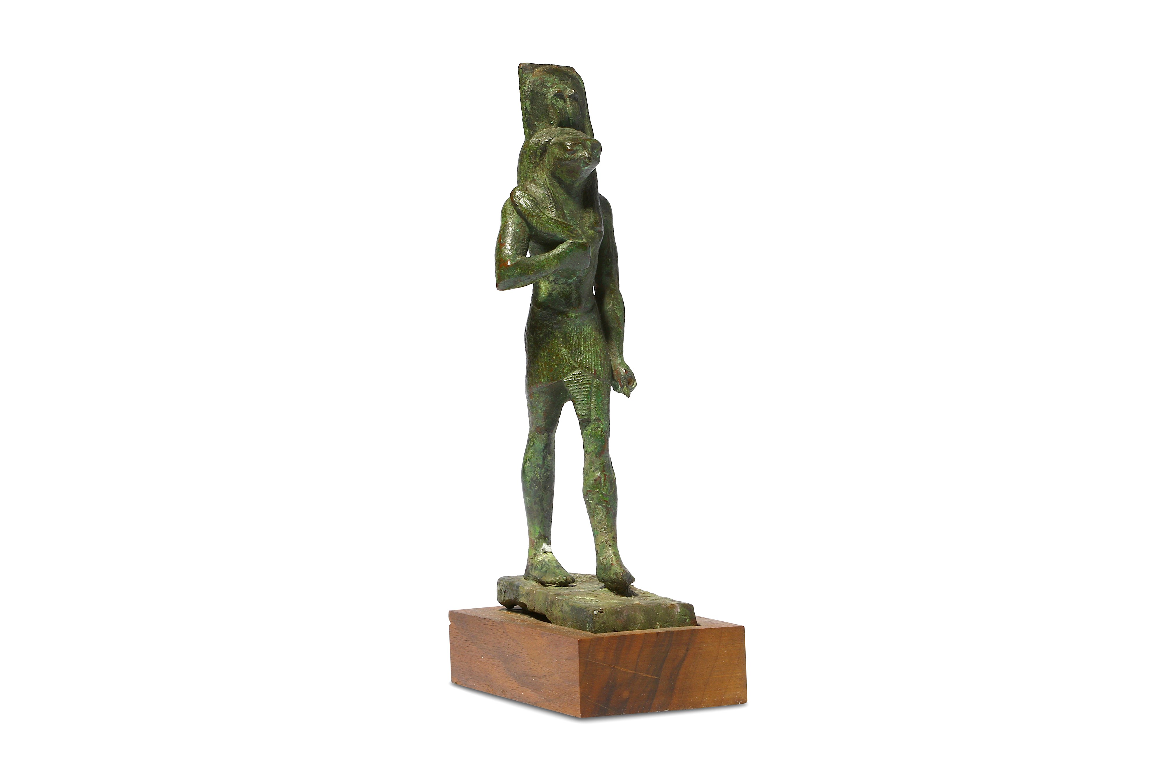 AN EGYPTIAN BRONZE FIGURE OF A FALCON-HEADED GOD