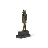 AN EGYPTIAN BRONZE FIGURE OF STRIDING ANUBIS