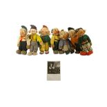 Seven Walt Disney style cloth dwarves