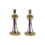 A pair of 19th Century gilt metal candlesticks,