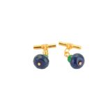 A pair of sapphire and emerald cufflinks