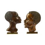 Manner of Franz Hagenauer, a pair of Art Deco cast bronze profile portrait busts