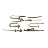 A collection of five 20th Century North African jambiya daggers