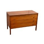 A mid 20th Century teak chest of three drawers
