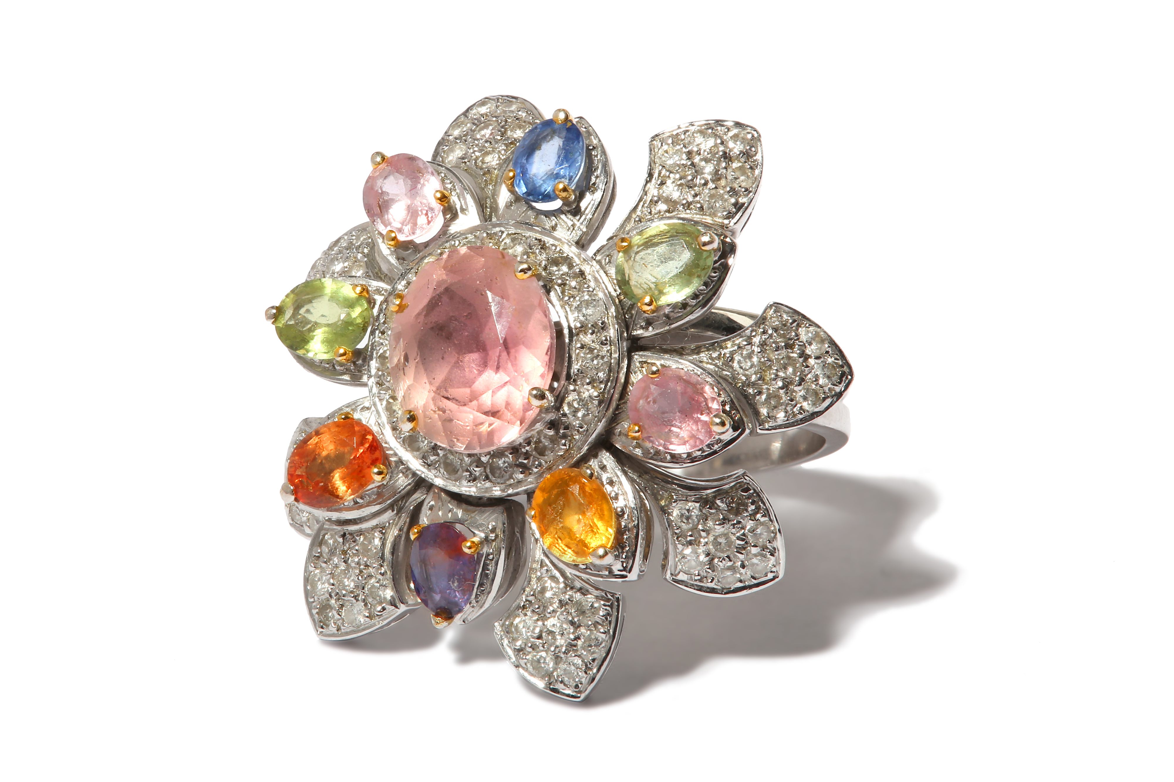 A large gem-set and diamond flower ring