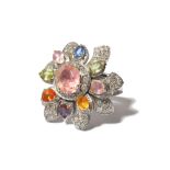 A large gem-set and diamond flower ring