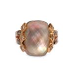 A faceted mother of pearl and diamond ring