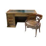 A late 19th Century French brass mounted mahogany and plum pudding desk