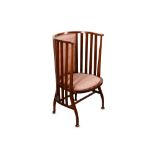 An Arts and Crafts Liberty type walnut barrel chair,