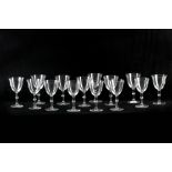 A set of fourteen 1980s Lalique crystal wine glasses,