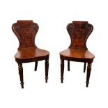A pair of 19th Century mahogany hall chairs