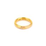 A gold band ring