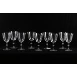 A set of nine 1980s Lalique crystal wine glasses,