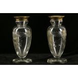 A pair of George V silver mounted cut glass vases