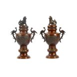 A pair of Japanese bronze vases and covers