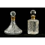 Two later 20th Century cut glass decanters, each with silver mounts,