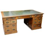 An early 20th Century mahogany partners desk,