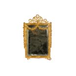 An early 20th Century gilt cast metal dressing table mirror