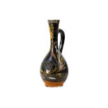 A BLACK-GLAZED POLYCHROME-PAINTED CANAKKALE EWER PROPERTY FROM THE THEO SARMAS COLLECTION