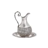 A mid-late 20th century Turkish 900 standard silver jug and under plate, stamped 900 and SK