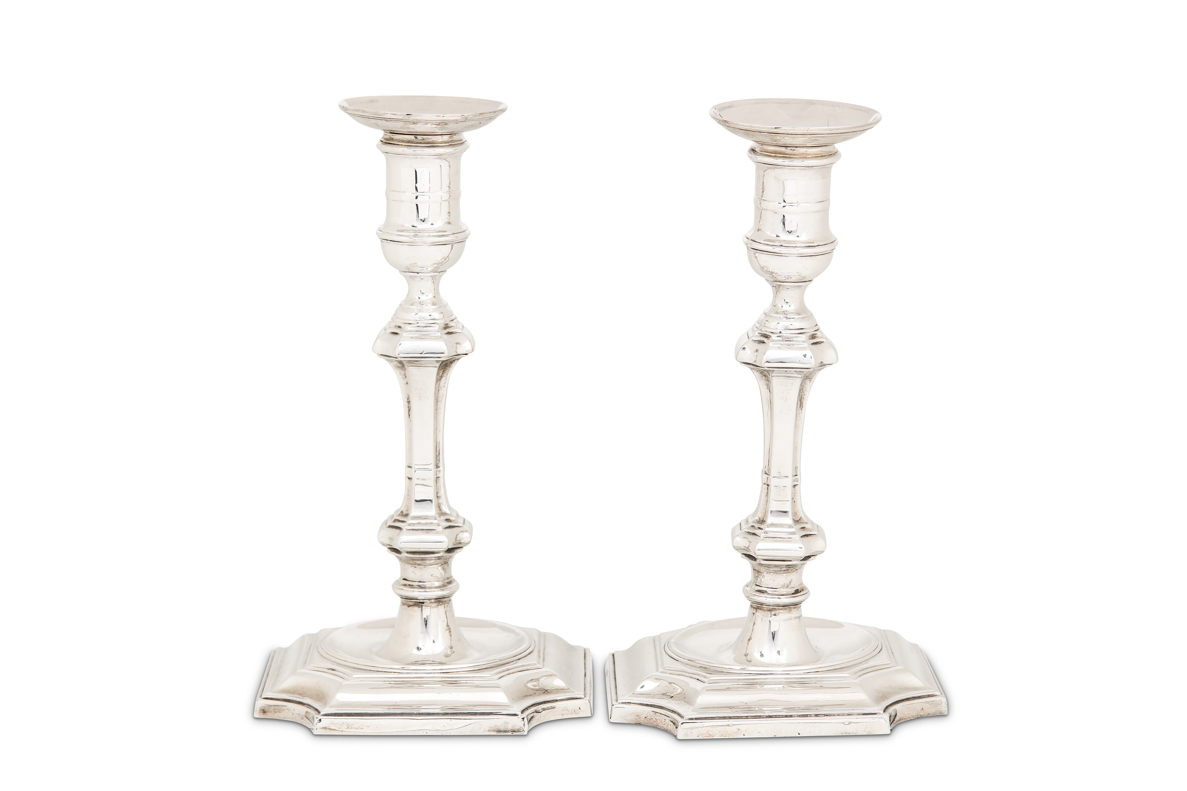 A pair of Edwardian sterling silver candlesticks, London 1906 by Hawksworth, Eyre & Co Ltd