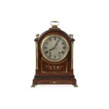 A late 19th / early 20th century mahogany and gilt brass mounted mantel clock