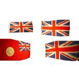 A large British red ensign with the Star of India, and three Union Jacks