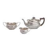 An Edwardian sterling silver three- piece tea service, Birmingham 1902/03 by William Atikin