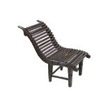 AN INDIAN WOODEN CHAISE-LONGUE