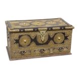 A RECTANGULAR ZANZIBAR TRUNK WITH BRASS STUDS AND FITTINGS