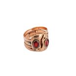 A 9ct gold garnet-set snake ring, 1909