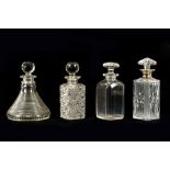 A collection of four glass decanters