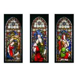 A 19TH CENTURY ENGLISH STAINED GLASS TRIPTYCH WINDOW DEPICTING THE NATIVITY