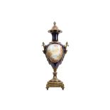 A 19TH CENTURY FRENCH SEVRES STYLE PORCELAIN AND GILT BRONZE MOUNTED URN AND COVER