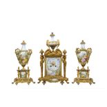 A LATE 19TH CENTURY FRENCH SEVRES STYLE PORCELAIN AND GILT BRONZE MOUNTED CLOCK GARNITURE