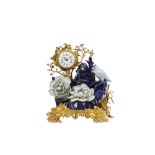 A 19TH CENTURY FRENCH GILT BRONZE AND PORCELAIN MANTEL CLOCK