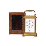 A LATE 19TH CENTURY FRENCH GILT BRASS QUARTER CHIMING CARRIAGE CLOCK