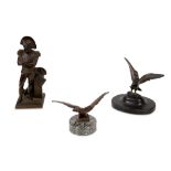 A 19TH CENTURY FRENCH BRONZE FIGURE OF NAPOLEON TOGETHER WITH TWO BRONZE MODELS OF EAGLES