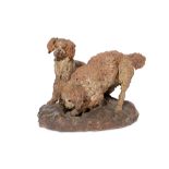 A LATE 19TH CENTURY PAINTED TERRACOTTA GROUP OF TWO SPANIELS