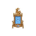 A LOUIS XVI STYLE GILT BRASS AND ENAMEL MANTEL CLOCK